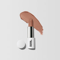 Product Shot with Color Swatch behind it of Ultra Suede® Lipstick by Makeup By Mario in shade Sierra (Soft Peachy Nude Pink)