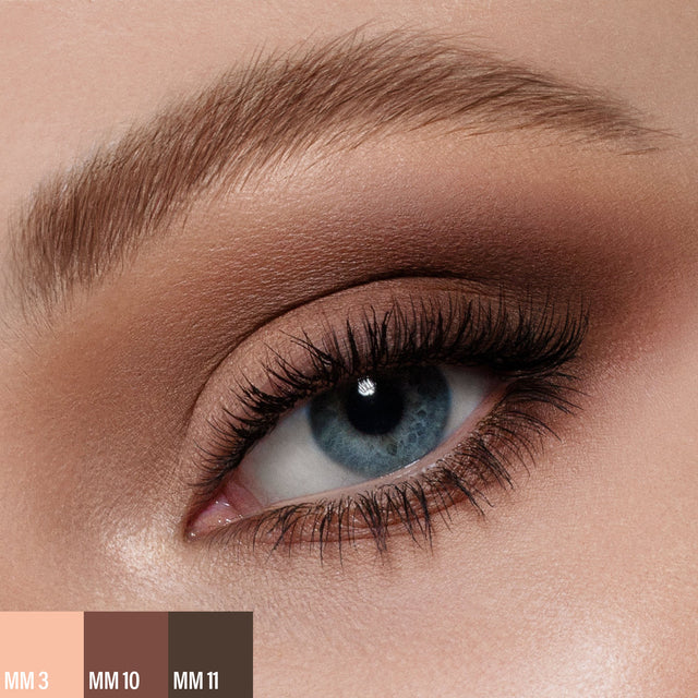 A female wearing three shades of the 
Master Mattes® Eyeshadow Palette: The Original.