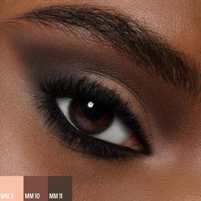 A female wearing two shades of the
Master Mattes® Eyeshadow Palette: The Original.
