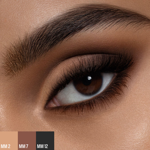 A female wearing two shades of the 
Master Mattes® Eyeshadow Palette: The Original.