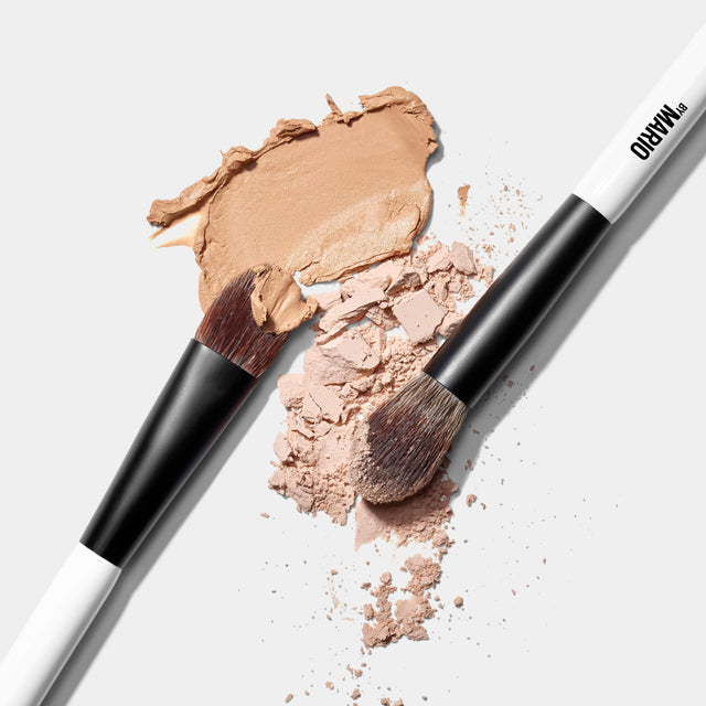 Makeup By Mario's EF1 Dual-Ended brush dipped in powder and cream makeup products