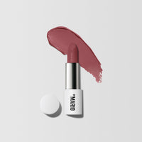 Product Shot with Color Swatch behind it of Ultra Suede® Lipstick by Makeup By Mario in shade Lucia (Berry Mauve)