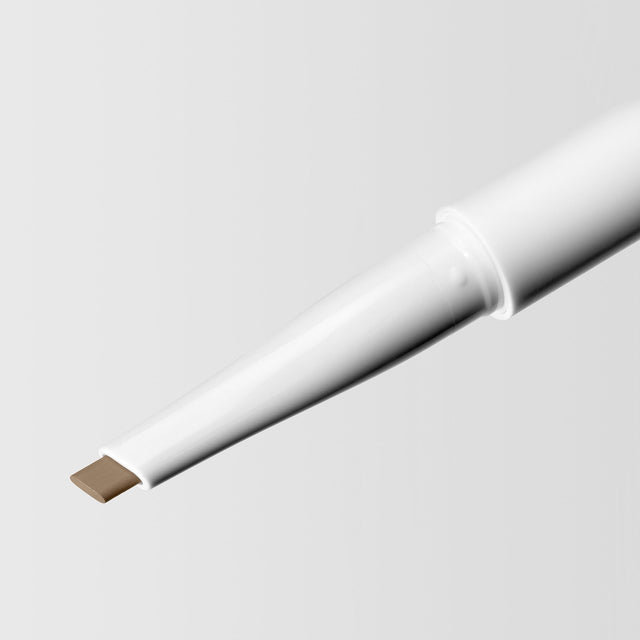 Close up image of the tip of the Master Blade® Brow Pencil in shade Blonde. 