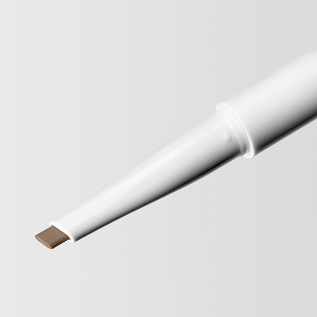 Close up image of the tip of the Master Blade® Brow Pencil in shade Dirty Blonde. 