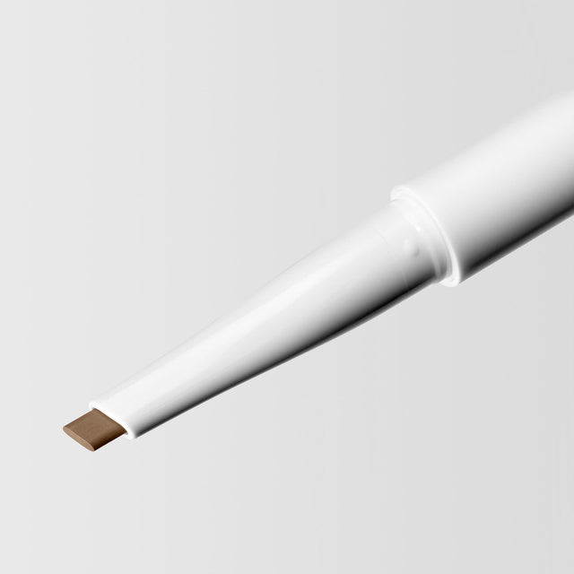 Close up image of the tip of the Master Blade® Brow Pencil in shade Light Brunette. 