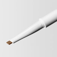 Close up image of the tip of the Master Blade® Brow Pencil in shade Honey Brunette. 