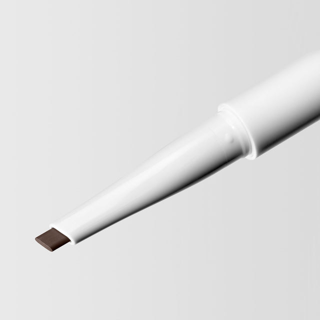 Close up image of the tip of the Master Blade® Brow Pencil in shade Deep Brunette. 