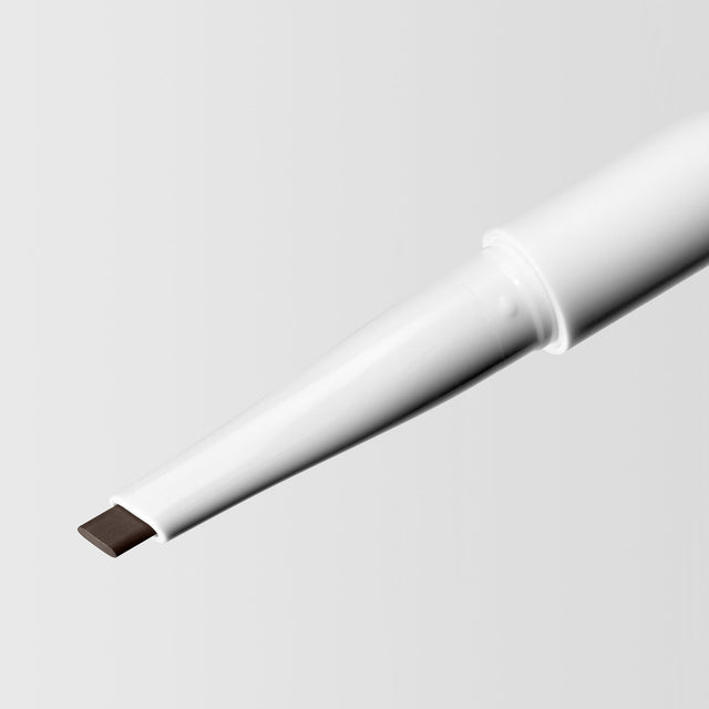 Close up image of the tip of the Master Blade® Brow Pencil in shade Brown Black. 