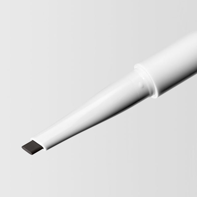 Close up image of the tip of the Master Blade® Brow Pencil in shade Almost Black. 