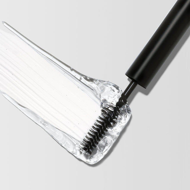 The Master Hold® Brow Gel brush swiping through the gel. 