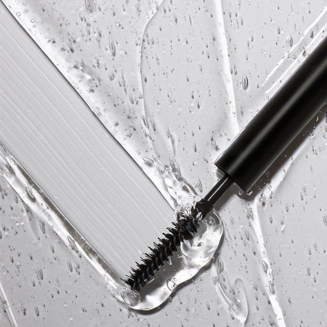 The Master Hold® Brow Gel brush swiping through the gel.