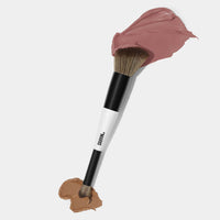 Makeup By Mario's F1 Dual-Ended Contour and blush brush dipped in cream blush and cream foundation. 